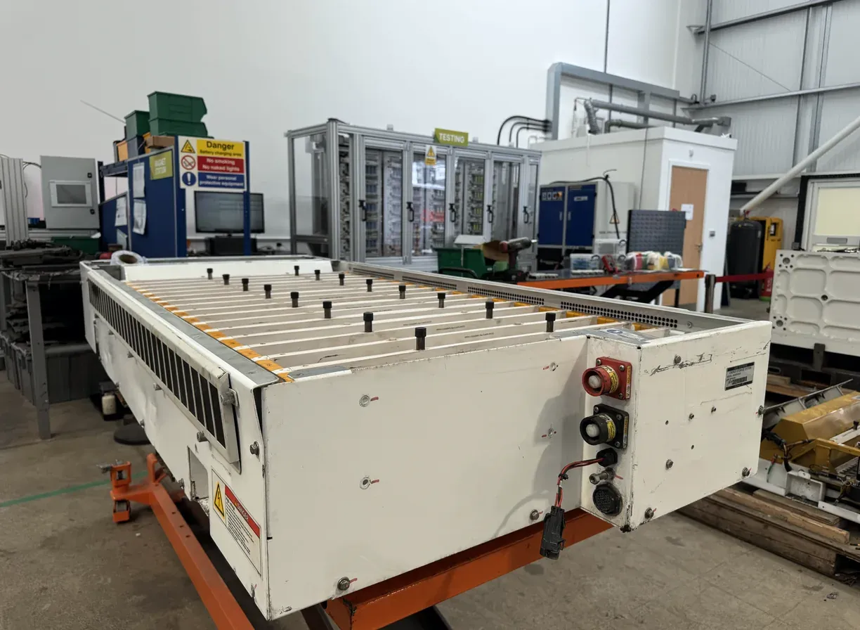 An end-of-life EV battery pack on a lift table at GTI, ready for disassembly