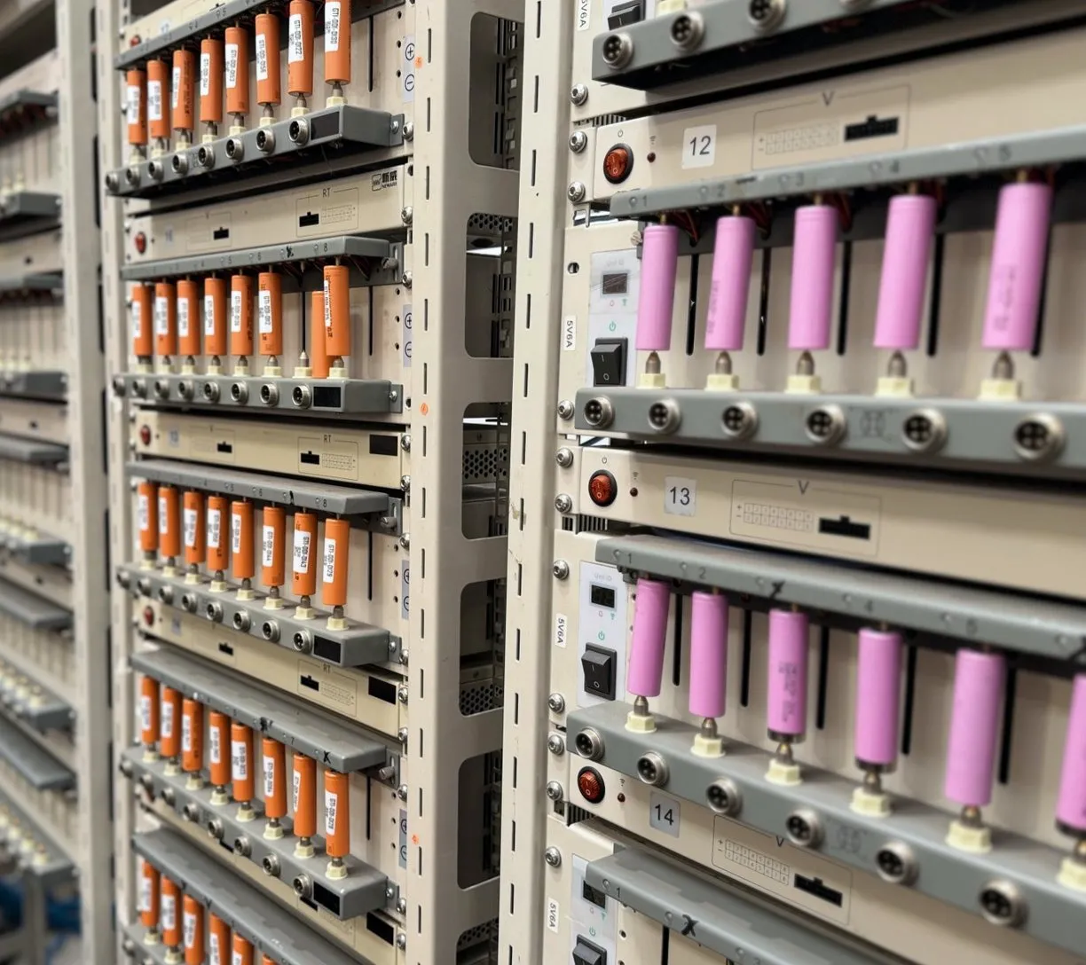 Racks of recovered cylindrical cells under test at GTI